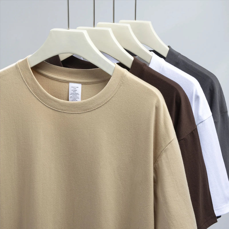 Camiseta Unissex em Algodão Puro – Modelagem Solta, Gola Redonda e Estrutura Densa em Branco Sólido