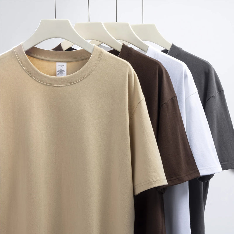 Camiseta Unissex em Algodão Puro – Modelagem Solta, Gola Redonda e Estrutura Densa em Branco Sólido